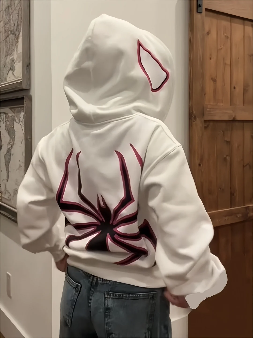 Brownm zip-up hoodie with spider pattern