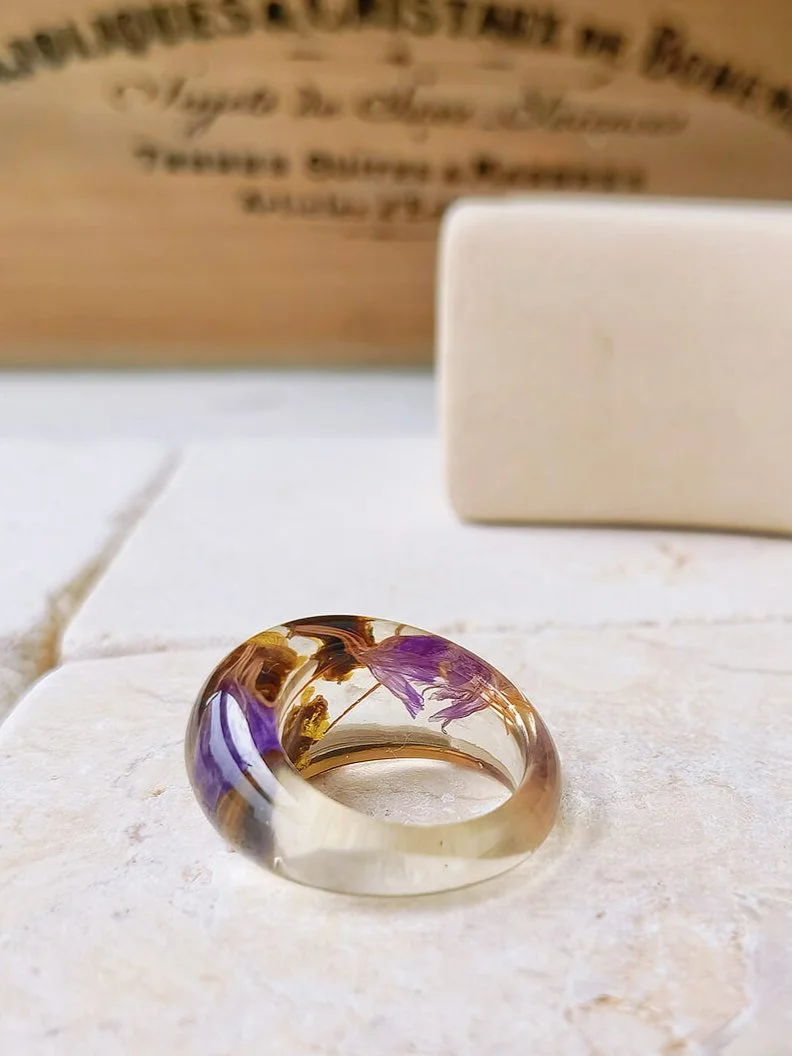 Dried flower resin ring with purple flowers
