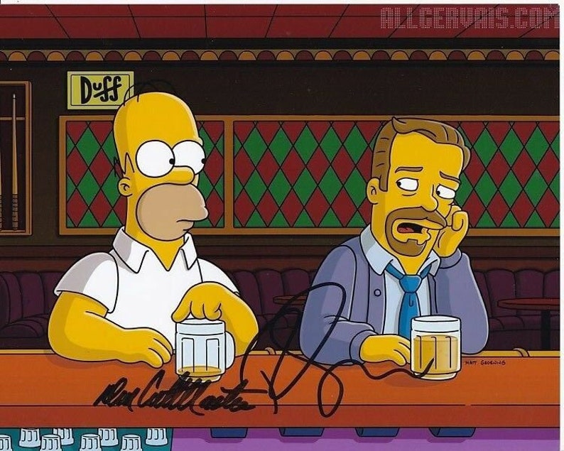 Ricky gervais and dan castellaneta signed autographed the simpsons Photo Poster painting