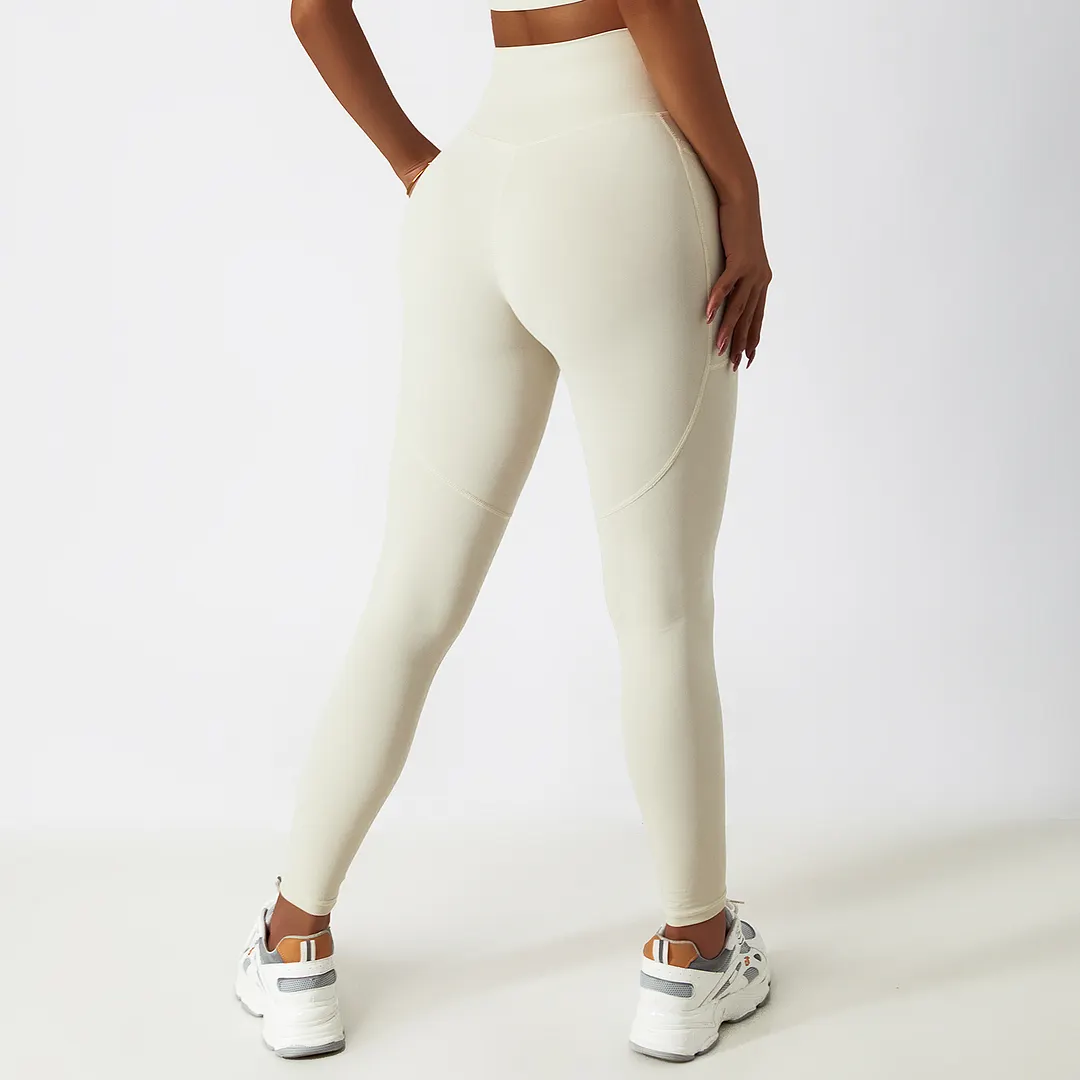 Buy Cream Apricot high rise no front seam squat proof cloud feeling breathable comfort lightweight non see through yoga pants with side pockets of high quality on Hergymclothing