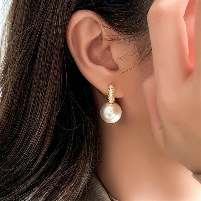 Large round pearl earrings
