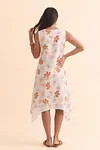 Back view of women's sleeveless floral midi dress with layered handkerchief hem