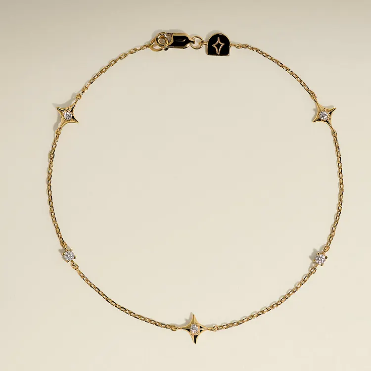 Cosmic Star Charm Bracelet in Gold