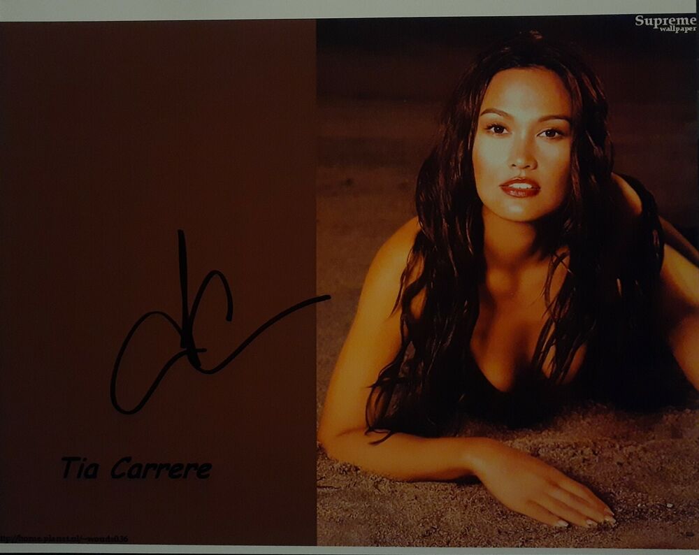 Tia Carrere signed 8x10