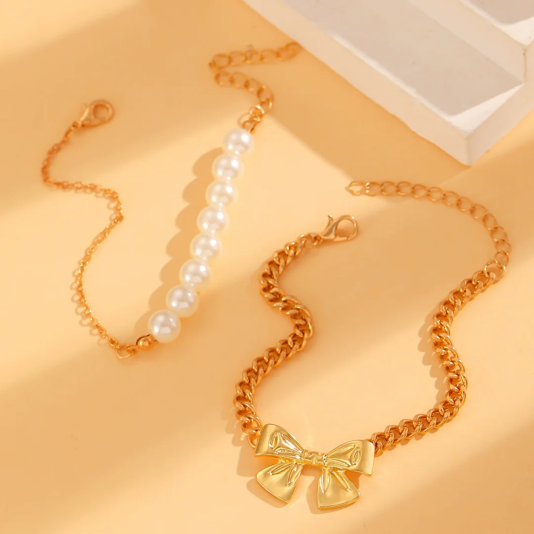Ribbon pearl two-strand gold-plated bracelet