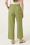 Back view of green relaxed-fit summer trousers showing elastic waistband and back pockets