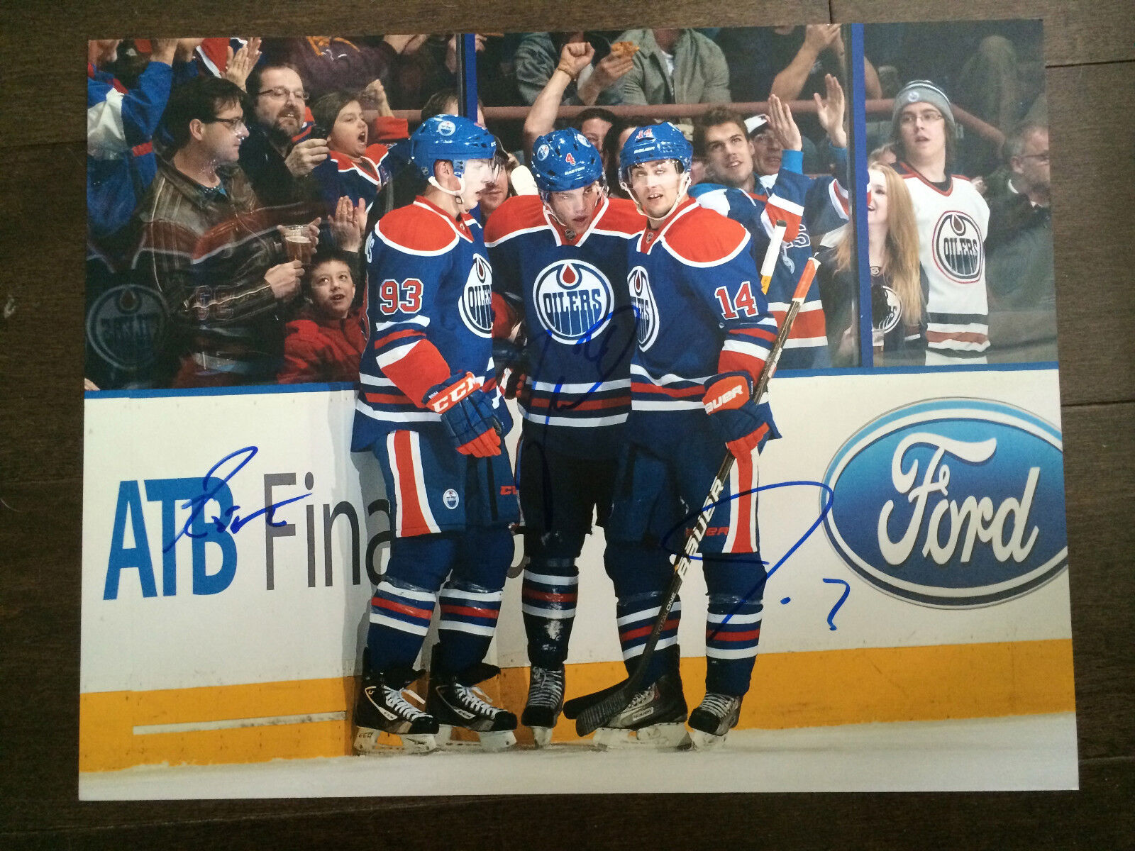 Edmonton Oilers Nugent Hopkins Taylor Hall Ebele Triple Autographed 11x14 COA