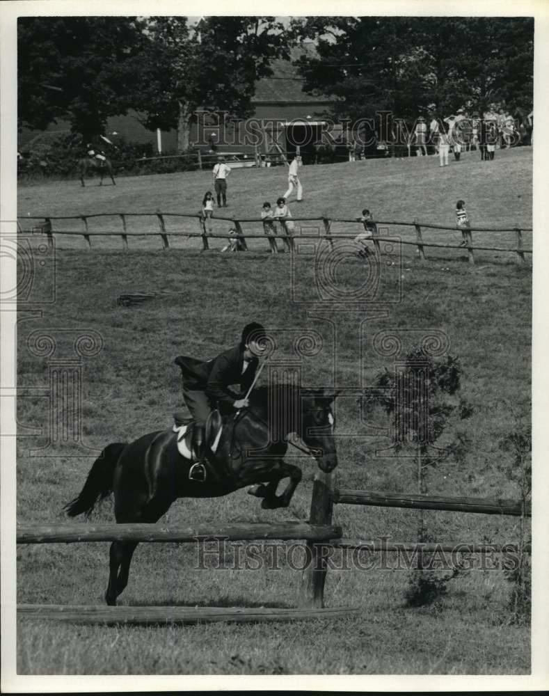 Press Photo Poster painting Rider makes jump at an annual horse shows in Montpelier, Vermont