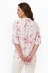 Back view of pink botanical print summer blouse showing back yoke and pleated comfort detail