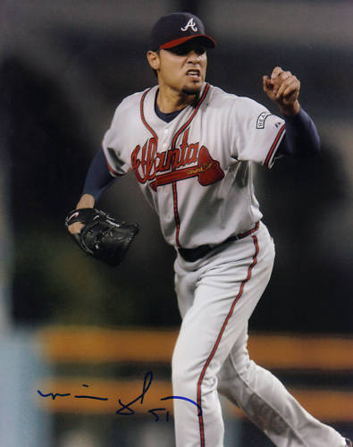 MIKE GONZALEZ ATLANTA BRAVES ACTION SIGNED 8x10