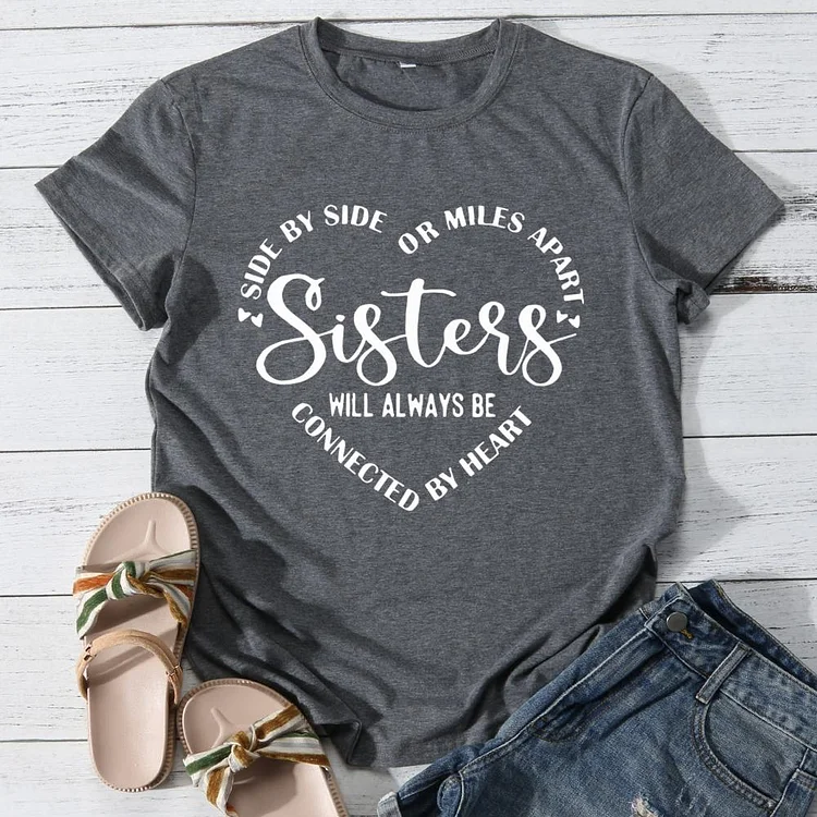 Side by side or miles apart sisters will always be connected by heart Round Neck T-shirt-0025971