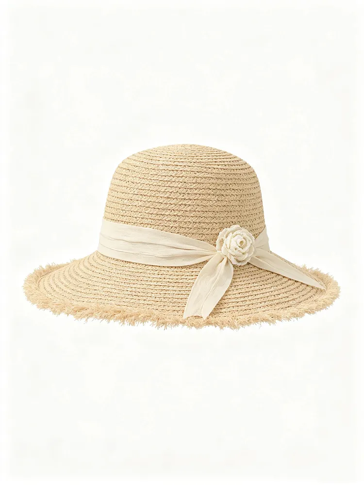 Dome-crowned straw hat with raw edges, wide brim, and floral bow detail.