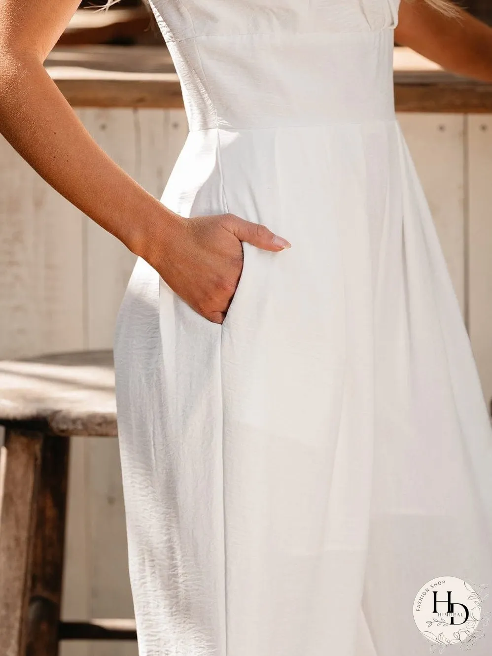 Elegant Beige Pleated Wide Leg Jumpsuit with Spaghetti Straps