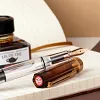 Brown transparent sand brown large-capacity piston inking pen for business office writing and calligraphy practice