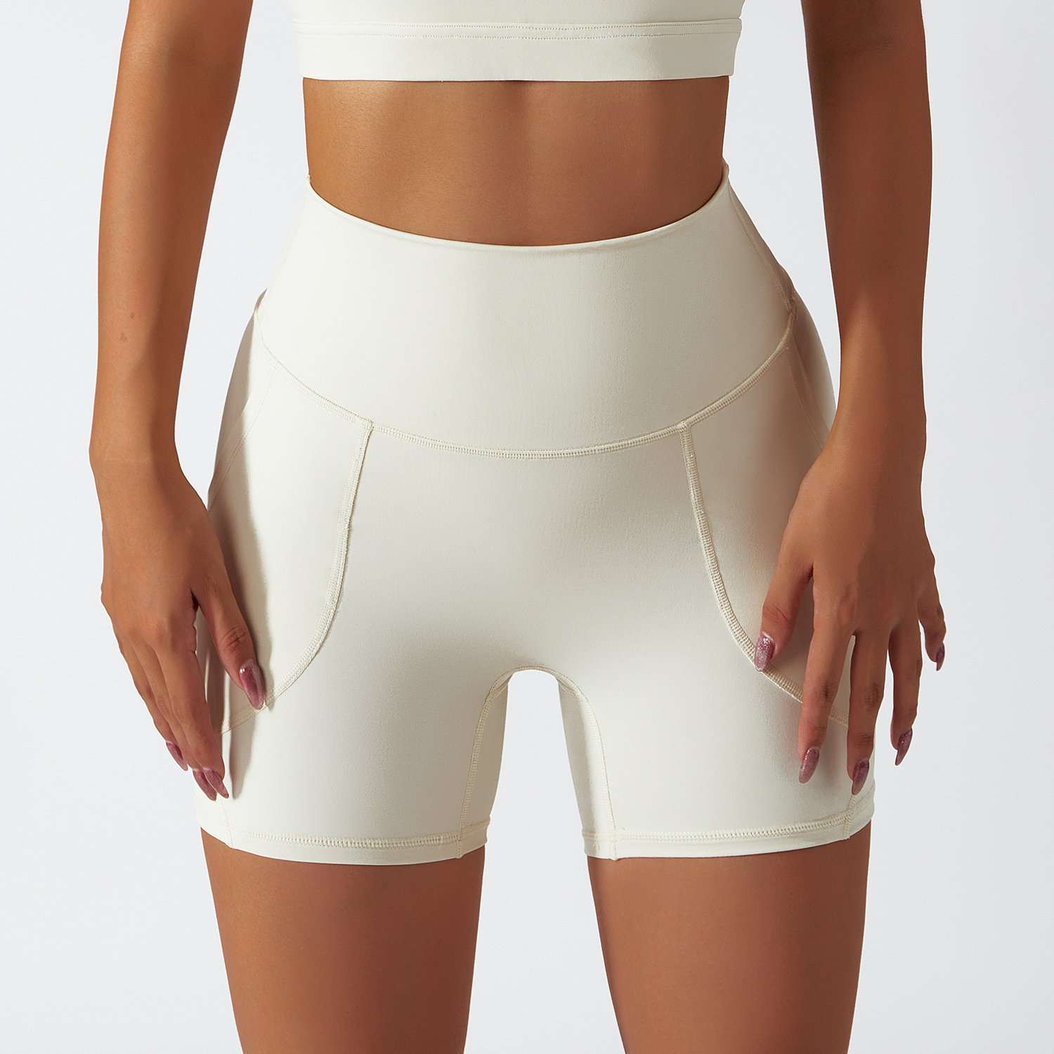 Hergymclothing Cream Apricot renewable fabric sustainable no front seam yoga shorts with side pockets for sale