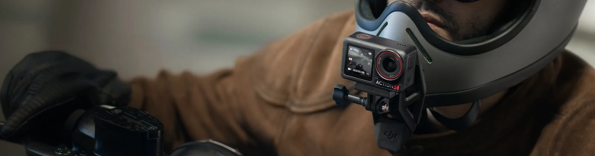 A man is using an Osmo Action 5 Pro to record his ride.