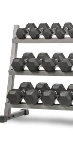 A zoomed-in view of an XMark 3-Tier Dumbbell Rack with rubber-coated hex dumbbells on it, 550 lb set