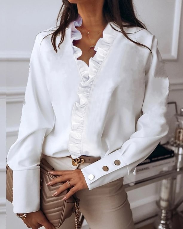Stylish long-sleeved shirt with ruffles and metal buttons