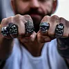 Bearded tough guy wearing hat skull rings for men