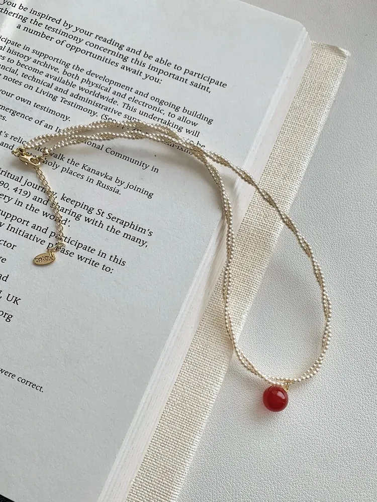 Multi-strand chain red gemstone pendant