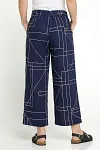 Back view of navy geometric trousers showing elasticated waistband and relaxed fit
