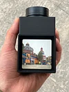 Handheld waist-level viewfinder composition trainer