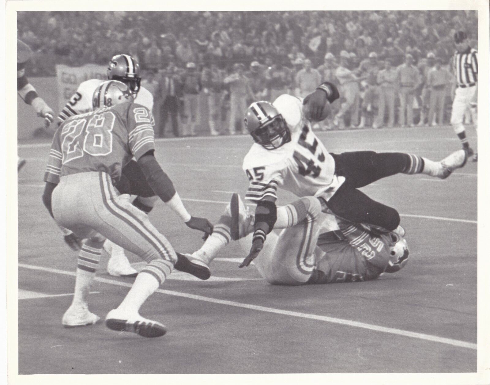 Stan White tackling Jack Holmes-1980 Detroit vs New Orleans 1980 B&W game Photo Poster painting