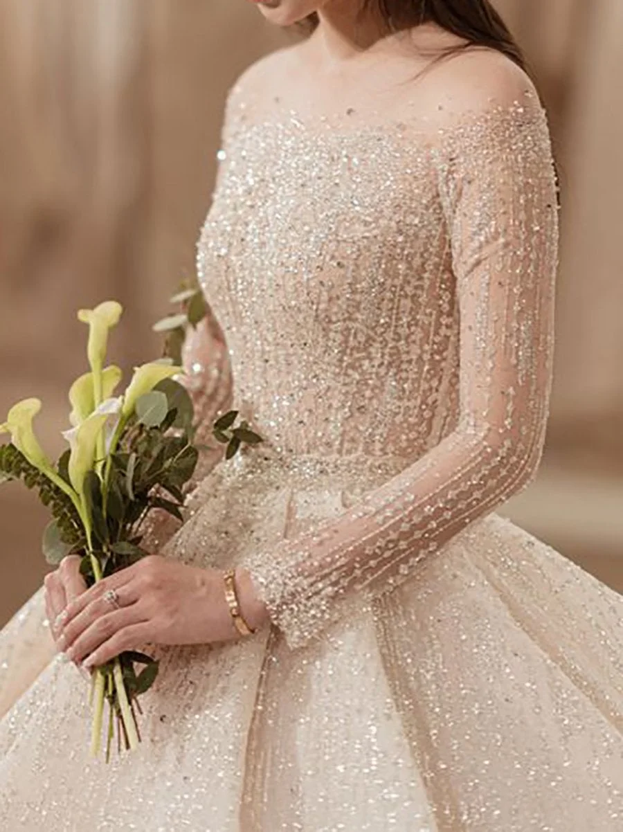 Midi sequined dress with round neck and long sleeves