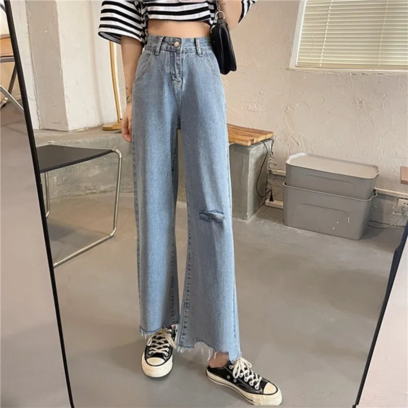 Ripped High Waist jeans for Women in wide leg denim clothing. Quality fashion at vintage