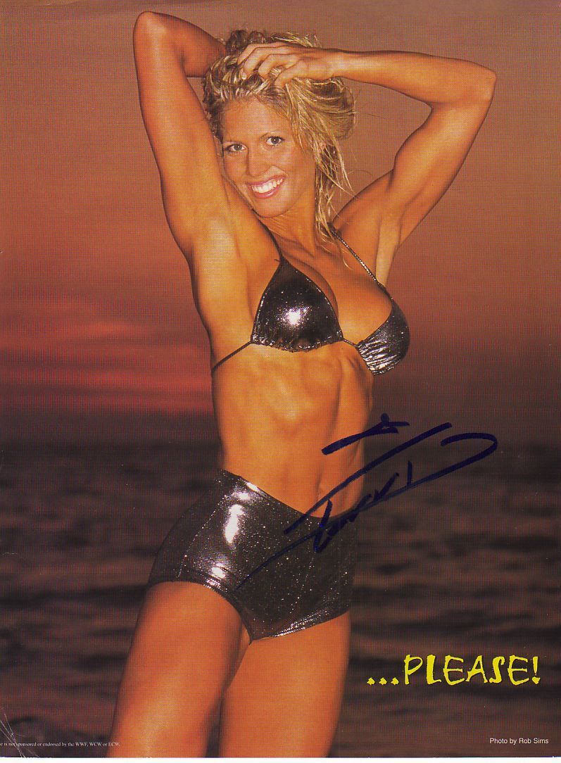 WWE WWF TORRIE WILSON SEXY AUTOGRAPHED HAND SIGNED 8X10 Photo Poster painting WRESTLING PICTURE