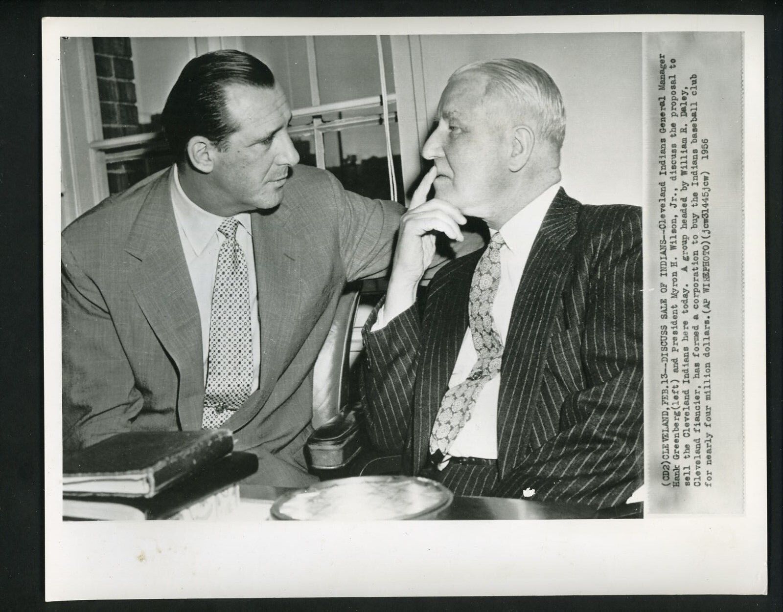 Hank Greenberg & Myron H. Wilson discuss sale of the Indians 1956 Press Photo Poster painting