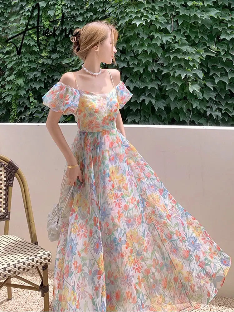 Aiertu Women's Summer Floral Dress Spaghetti Strap Dress Backless Puff Sleeves Sweet A-line Off Shoulder Midi Dress Holiday Aiertu