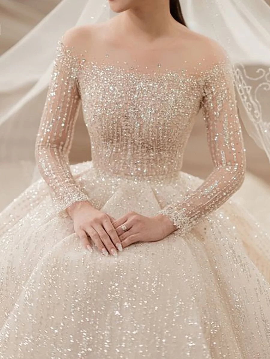 Midi sequined dress with round neck and long sleeves