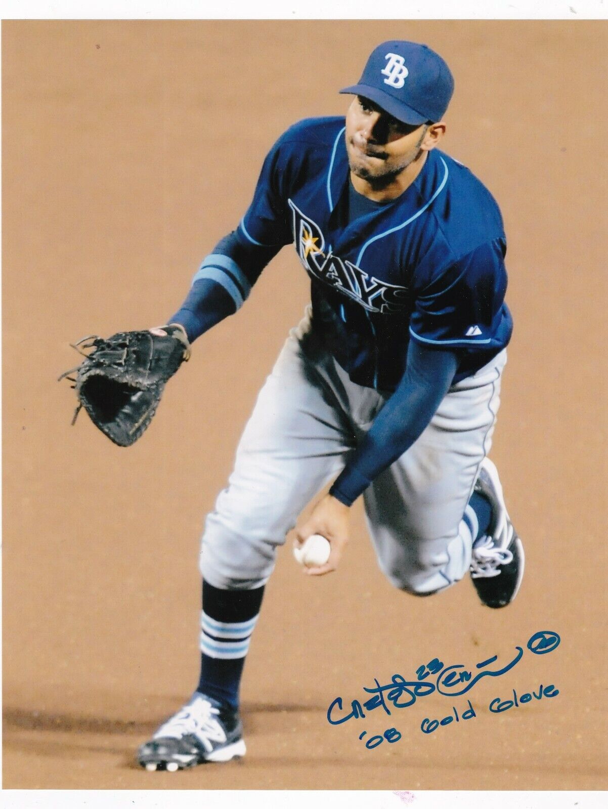 CARLOS PENA TAMPA RAYS 08 GOLD GLOVE ACTION SIGNED 8x10