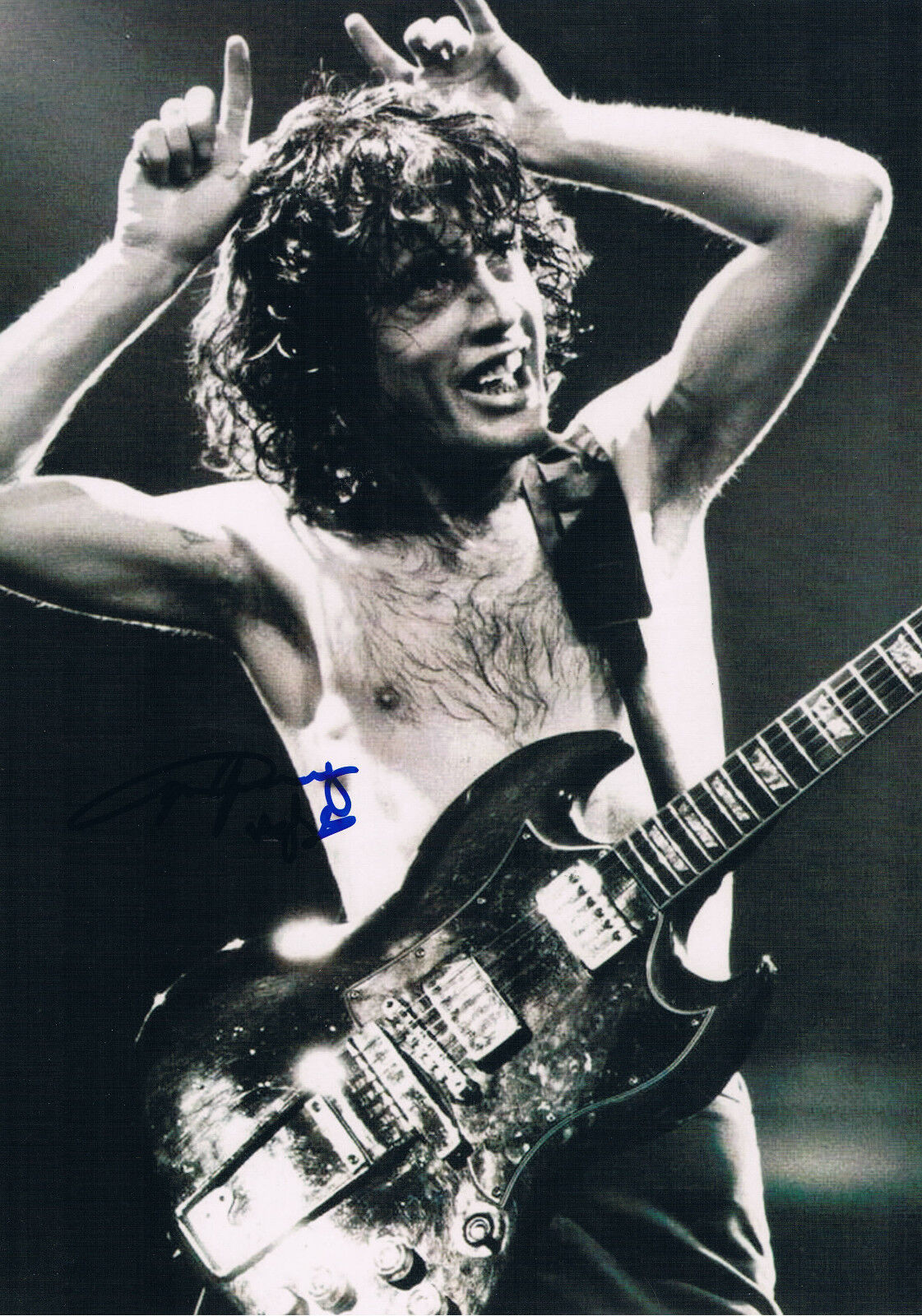 AC/DC Angus Young 1955- genuine autograph Photo Poster painting 8x12