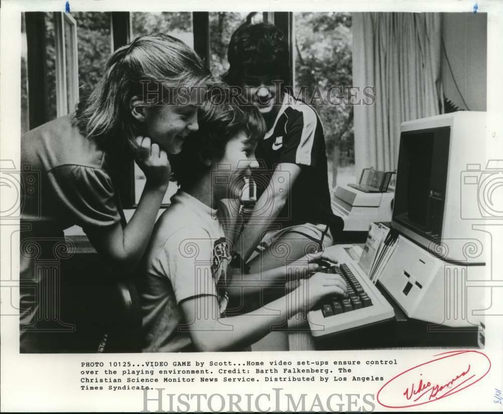 Press Photo Poster painting Children play games at a home video set-up