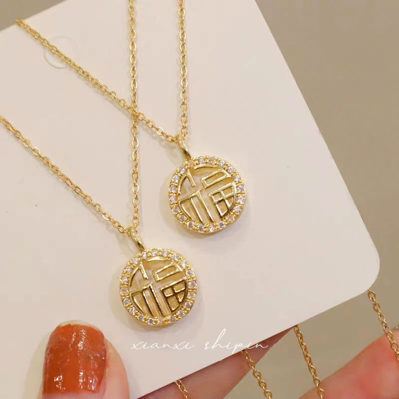 Skeleton Chinese &ldquo;Happiness&rdquo; gold plated necklace