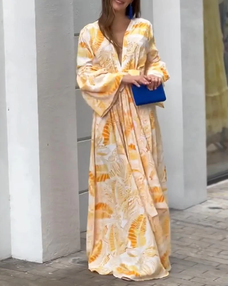 Printed dress with deep V neck and high waist with flared sleeves