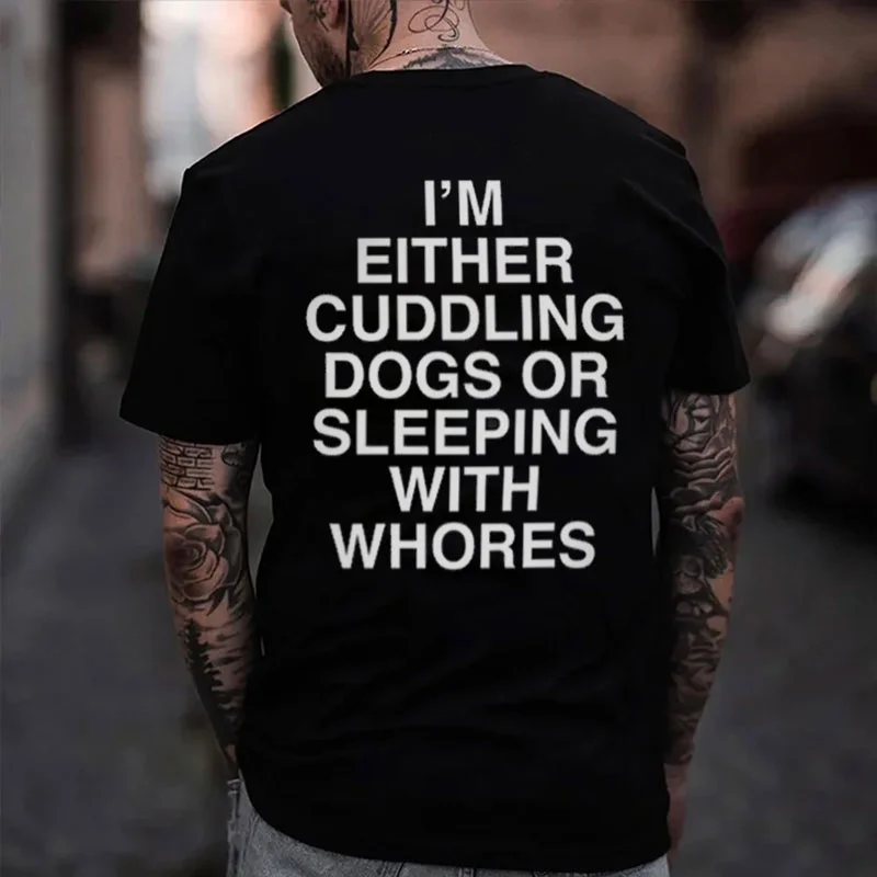 I'M EITHER CUDDLING DOGS OR SLEEPING WITH WHORES Black Print T-Shirt