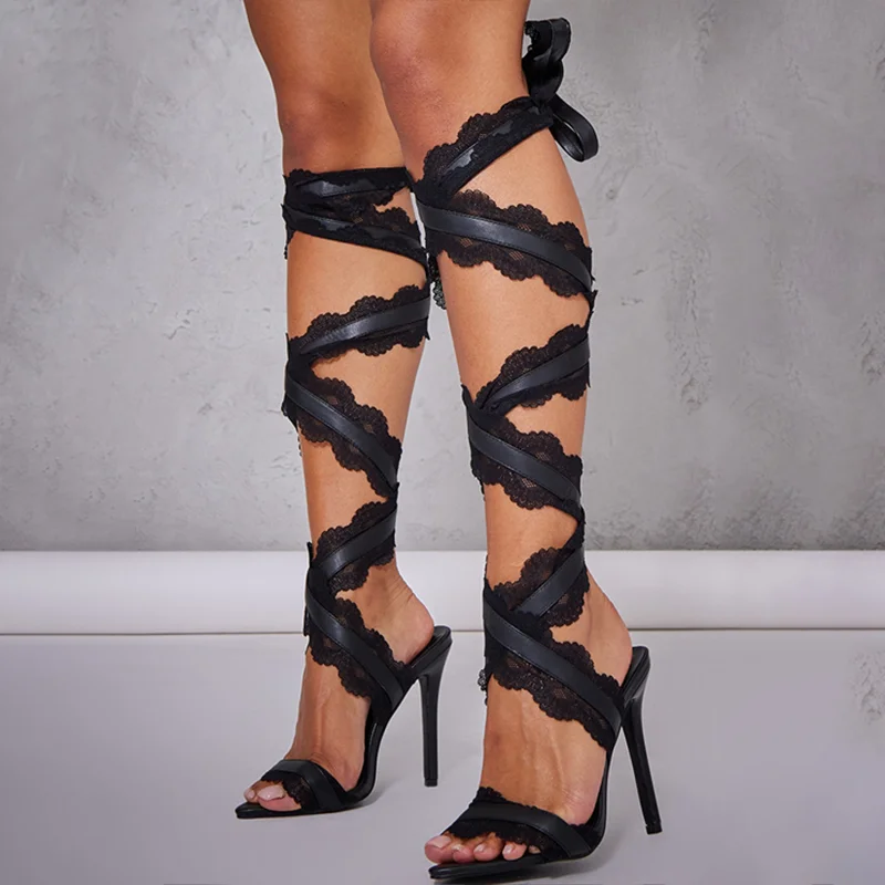 Black strappy hotsell thigh high sandals