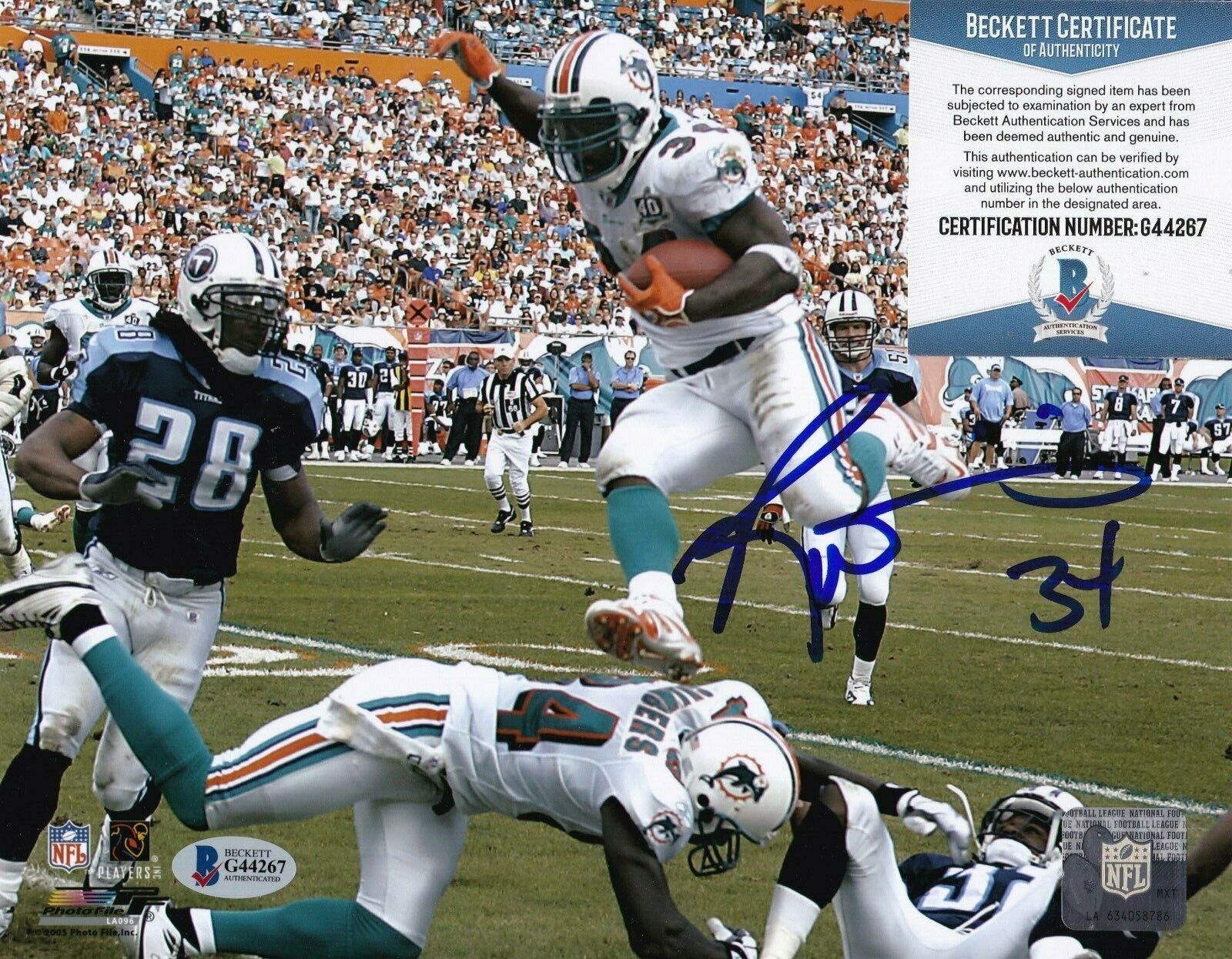 RICKY WILLIAMS MIAMI DOLPHINS BECKETT AUTHENTICATED ACTION SIGNED 8x10