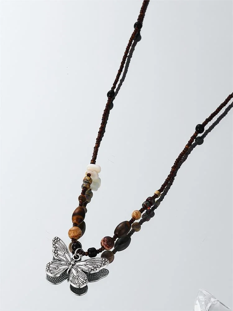 Brownm butterfly necklace with pearl stones