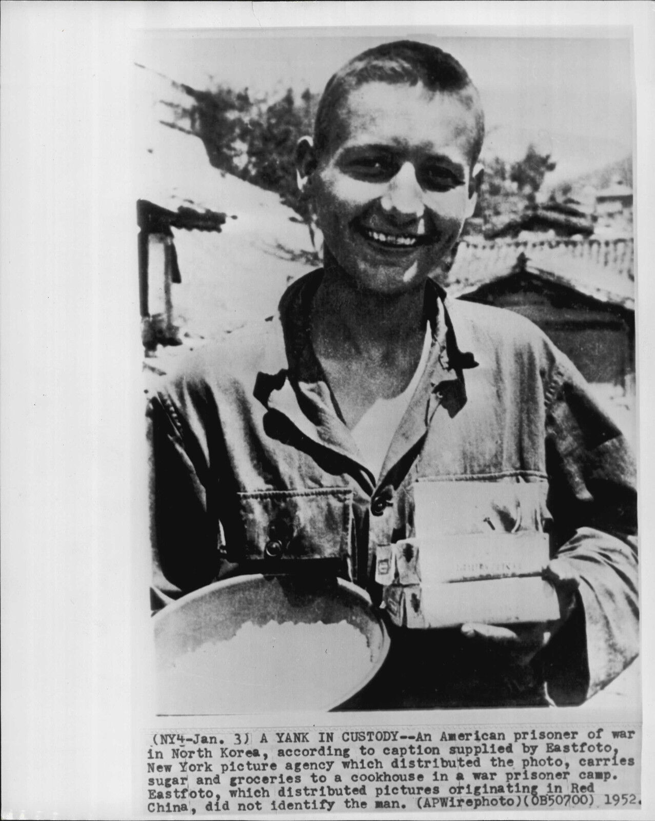 American Prisoner Gets Sugar and Groceries 1952 Eastfoto Korea War Press Photo Poster painting