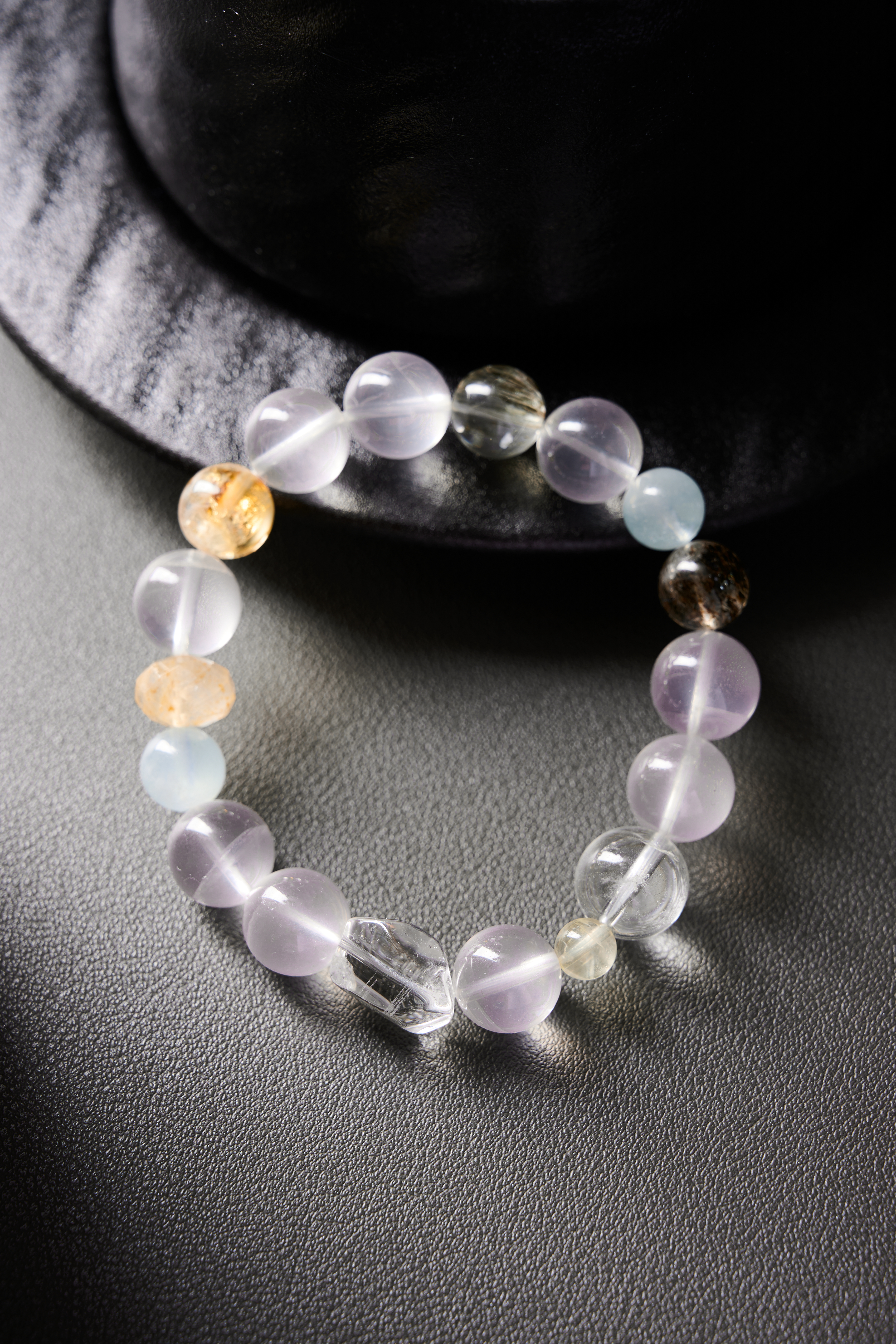 Full bracelet circle on wooden tray, translucent aquamarine with clear quartz accent bead