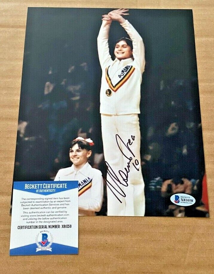 NADIA COMANECI SIGNED OLYMPICS 8X10 Photo Poster painting BECKETT CERTIFIED #2