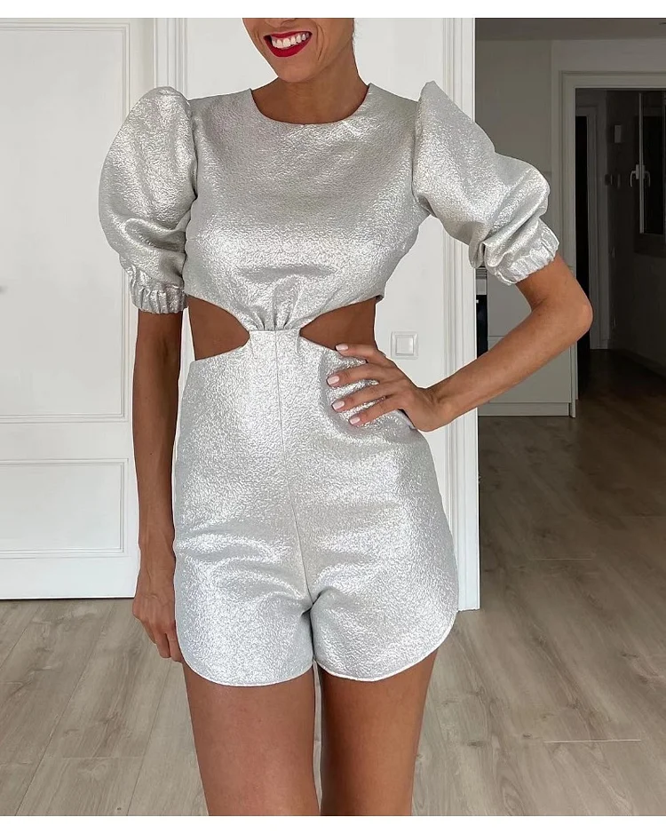 A woman in a solid short sleeve suit