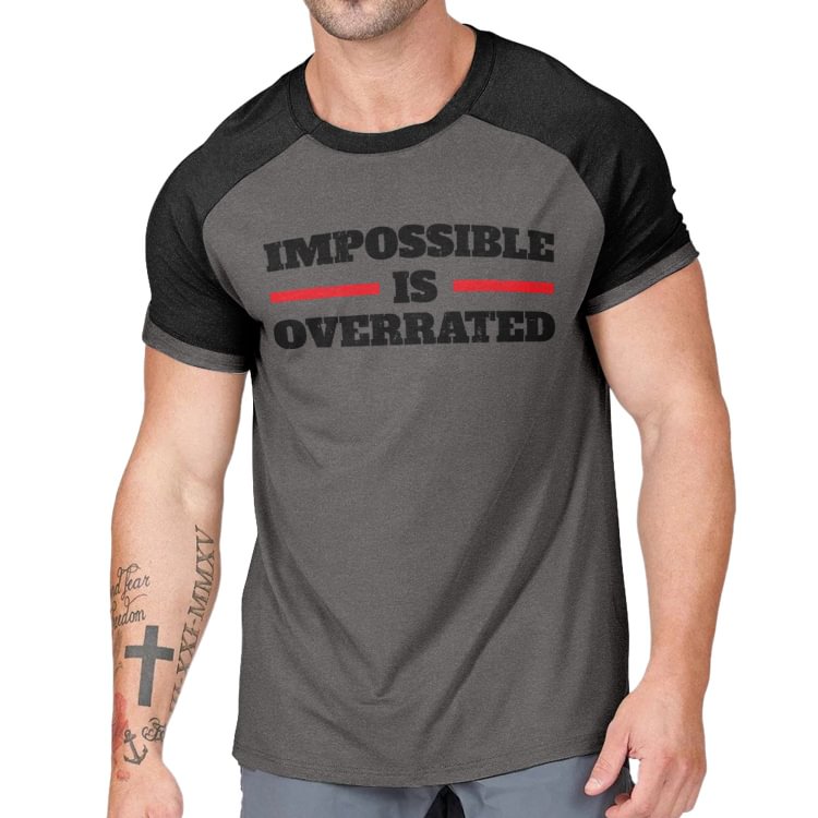 IMPOSSIBLE IS OVERRATED MOISTURE WICKING RAGLAN GRAPHIC TEE