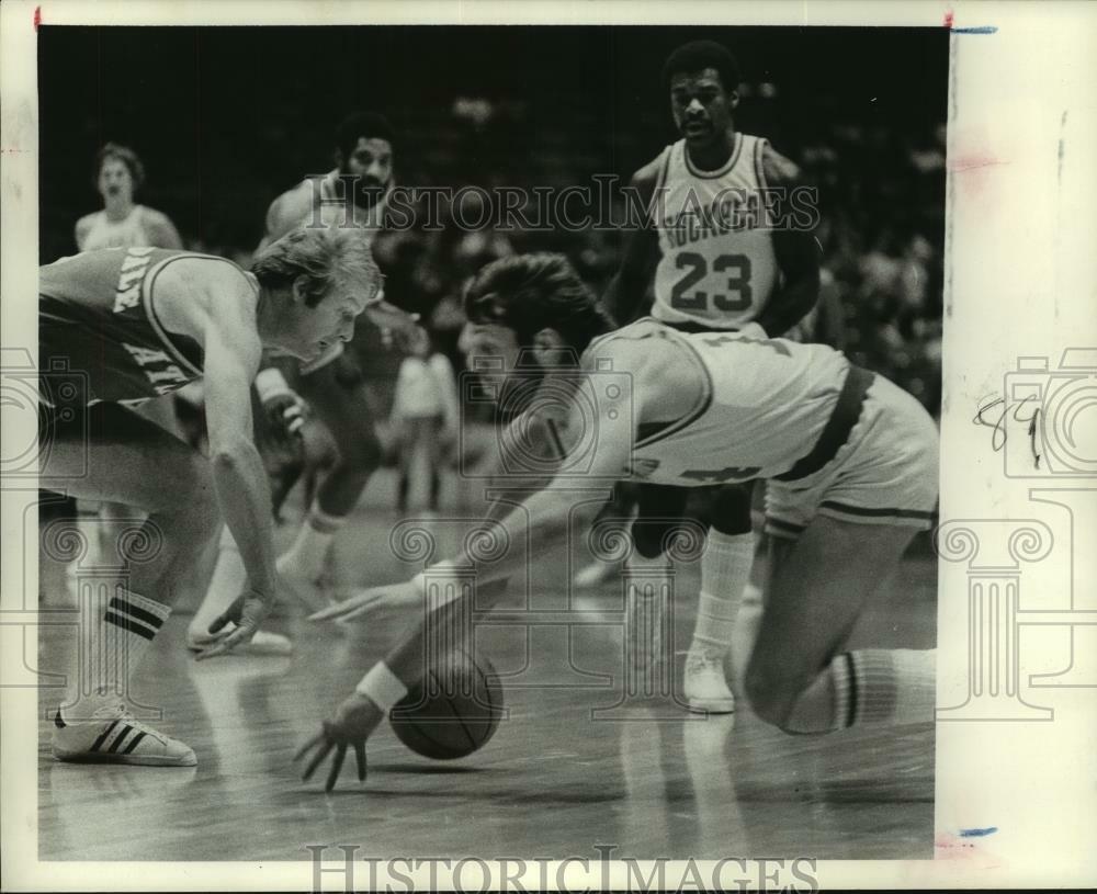 Press Photo Poster painting Rockets' Mike Newlin stumbles and looses basketball against Atlanta.