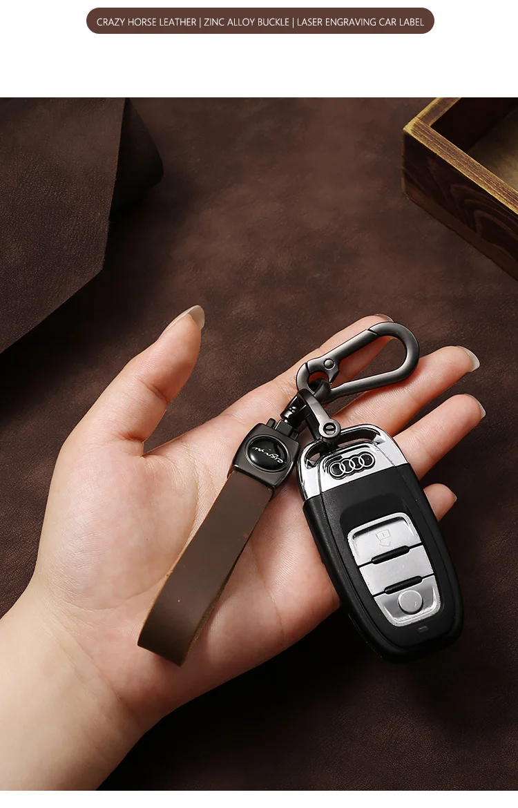 🔥Hot sale🔥Exclusive logo🔥Car anti-lost genuine leather alloy keychain