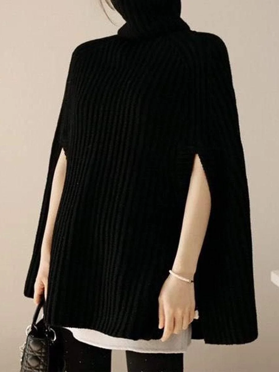 A pullover with a high collar that goes with a poncho knit sweater with split ends